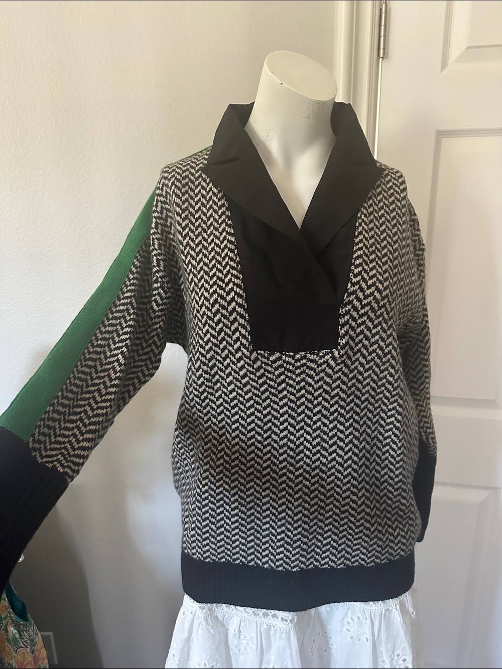 Black & White Herringbone Sweater with Green Sleeve Accent